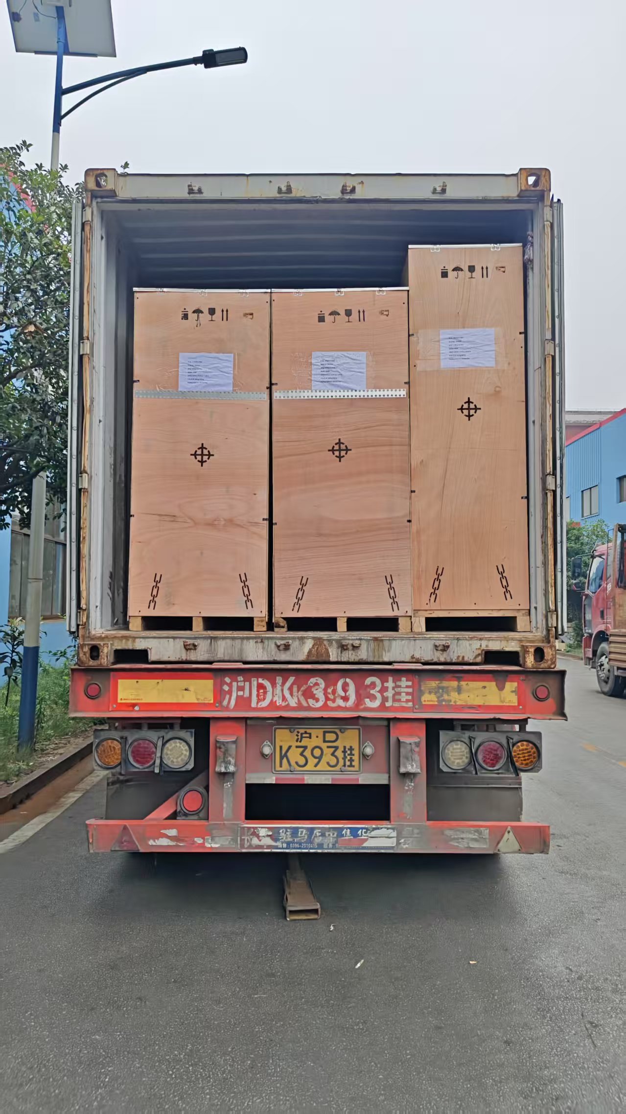 Wooden machine cases arranged inside a full shipping container